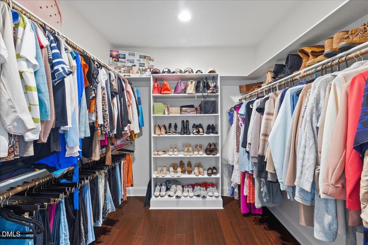 1304 Flying Hawk Road Apex, NC 27523 - Photo 22 of 52 a view of walk in closet with clothes