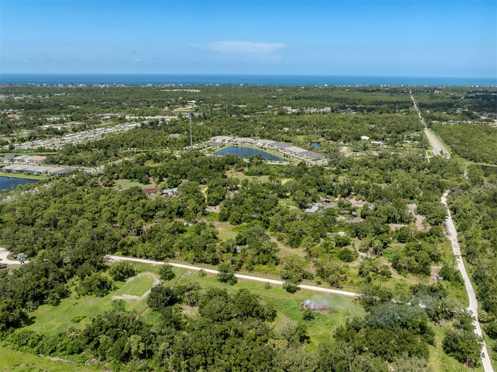 East Manasota Beach Road Englewood, FL 34223 - Photo 11 of 65 an aerial view of residential houses with outdoor space and trees