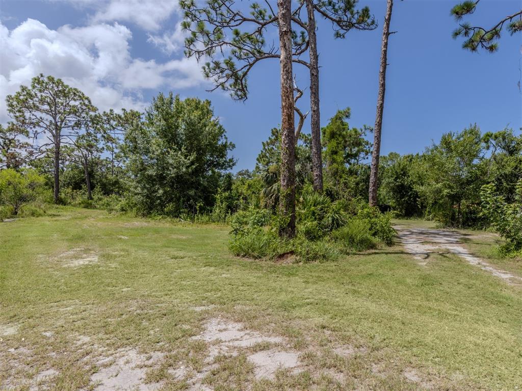 East Manasota Beach Road Englewood, FL 34223 - Photo 19 of 65 a view of a field with an trees