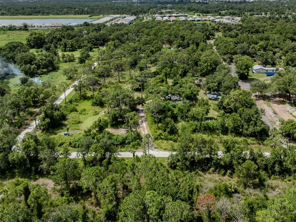 East Manasota Beach Road Englewood, FL 34223 - Photo 29 of 65 an aerial view of a house with a yard
