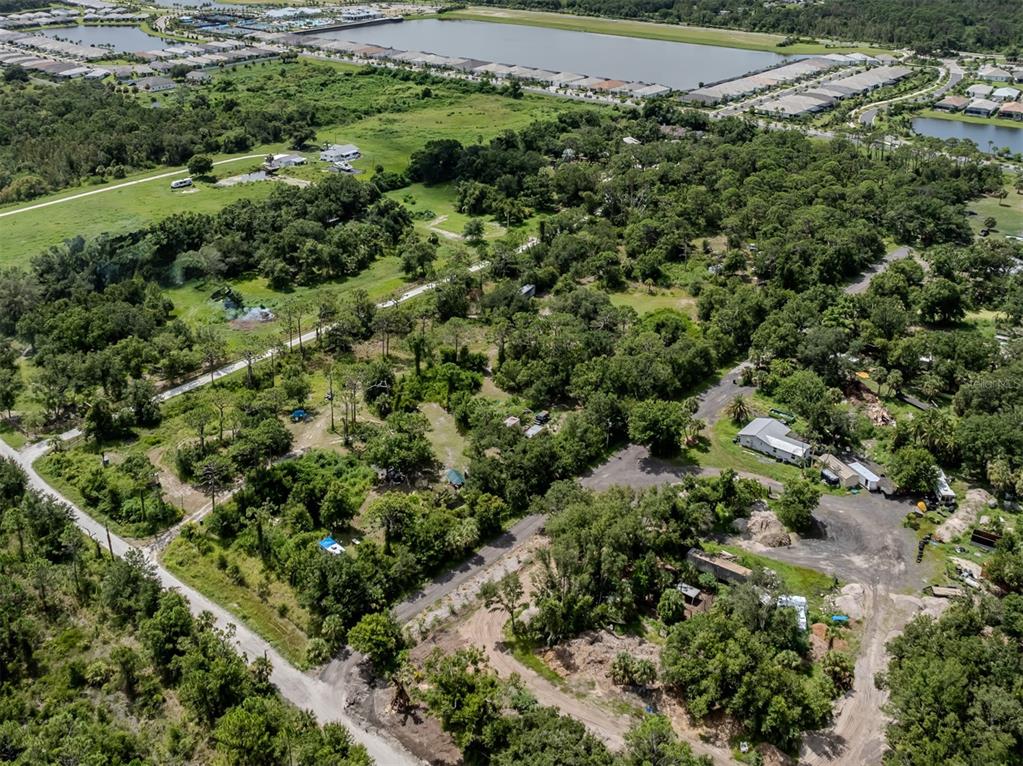 East Manasota Beach Road Englewood, FL 34223 - Photo 30 of 65 an aerial view of a house with a yard