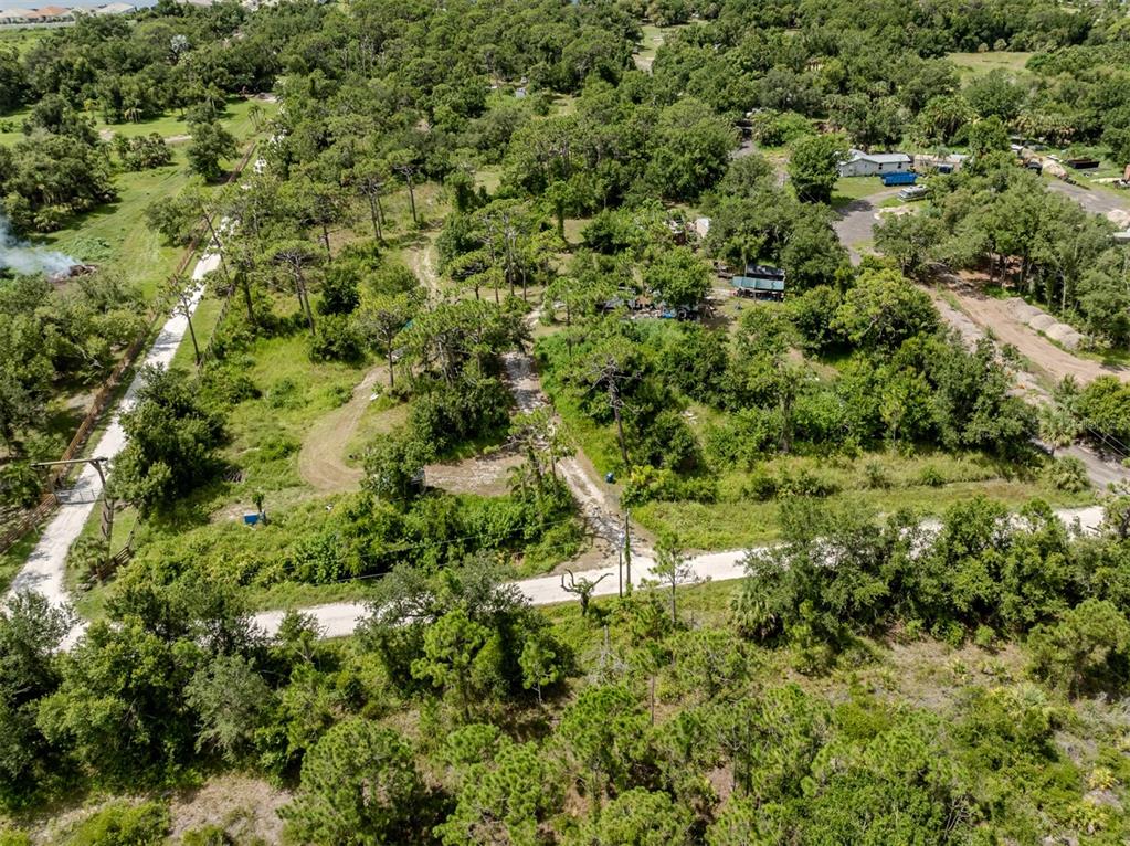East Manasota Beach Road Englewood, FL 34223 - Photo 32 of 65 an aerial view of residential houses with outdoor space and trees