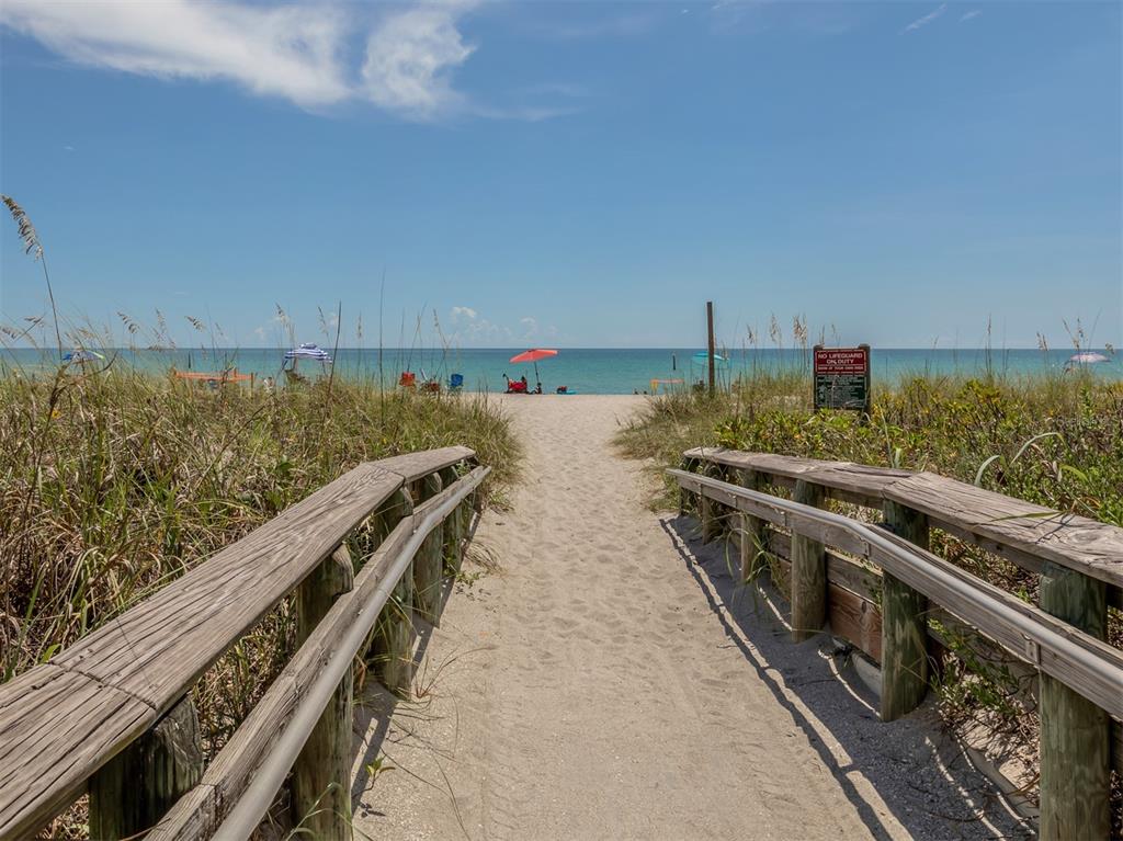 East Manasota Beach Road Englewood, FL 34223 - Photo 55 of 65 a view of a balcony with wooden floor and fence