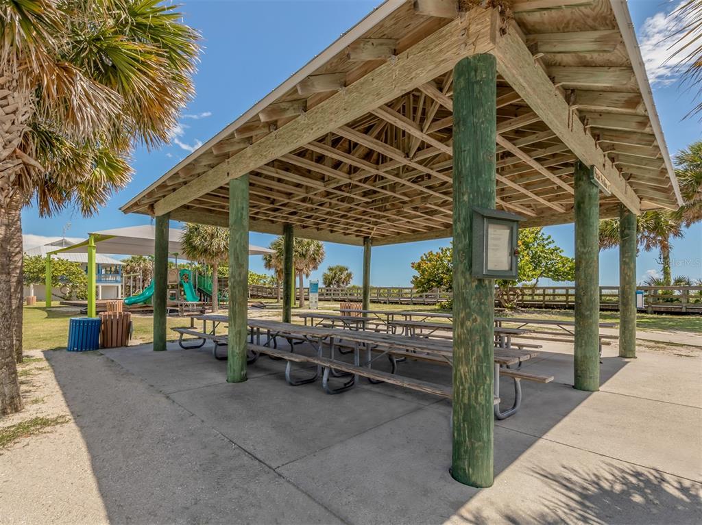 East Manasota Beach Road Englewood, FL 34223 - Photo 58 of 65 a view of a porch with furniture and a patio
