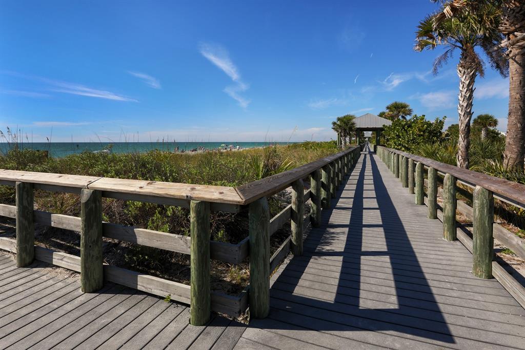 East Manasota Beach Road Englewood, FL 34223 - Photo 59 of 65 a view of a balcony with wooden floor and outdoor space