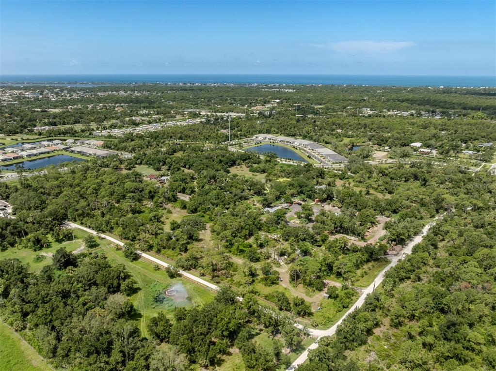 East Manasota Beach Road Englewood, FL 34223 - Photo 8 of 65 an aerial view of residential houses with outdoor space and trees