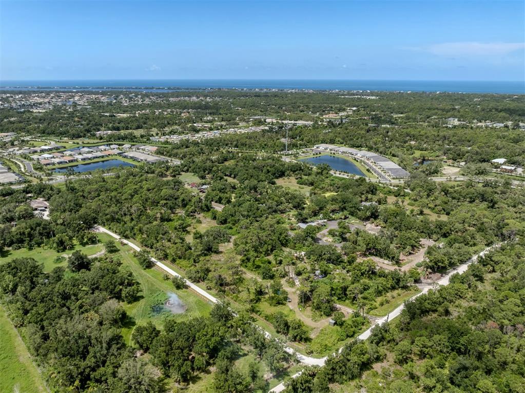 East Manasota Beach Road Englewood, FL 34223 - Photo 9 of 65 an aerial view of residential houses with outdoor space and trees
