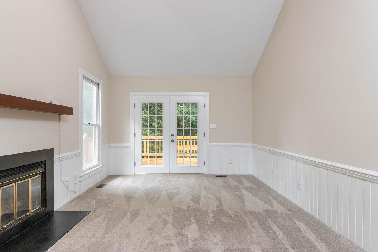 7305 Wilderness Road Raleigh, NC 27613 - Photo 5 of 27 Living Room w/ Natural Lighting