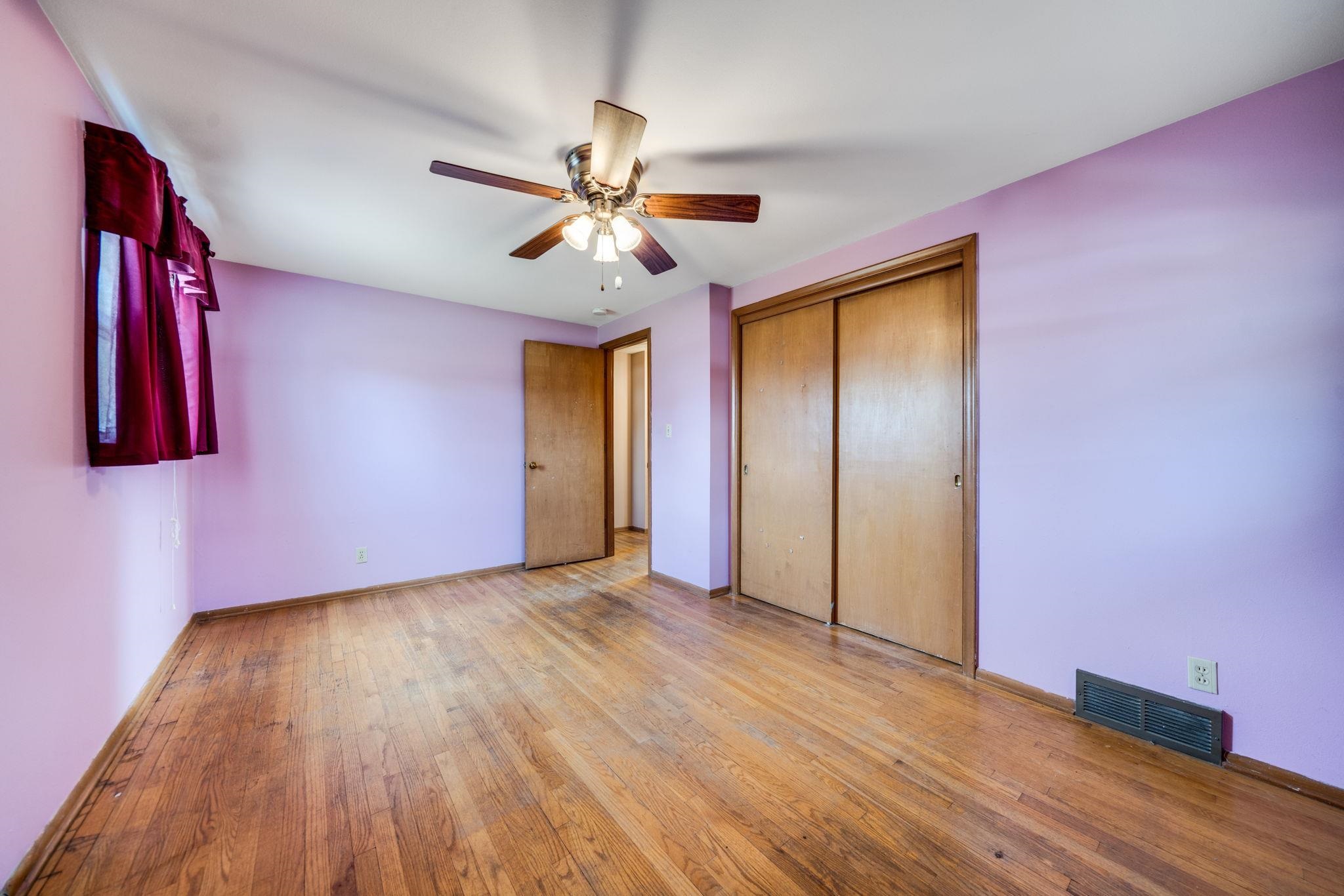 1611 Notre Dame Road Rockford, IL 61103 - Photo 17 of 33 a view of empty room with wooden floor and fan