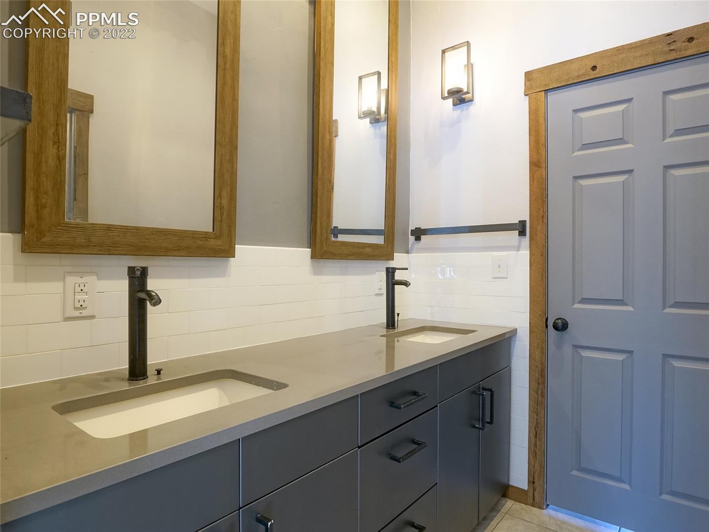 7970 Juniper Road Colorado Springs, CO 80908 - Photo 19 of 43 Jack and Jill bathroom connecting upper bedrooms
