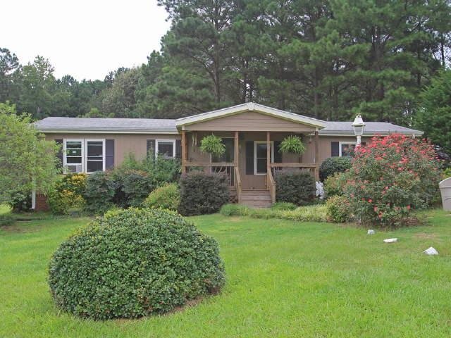 187 Dean Patrick Road Jackson, GA 30233 - Photo 1 of 1 a front view of a house with a yard