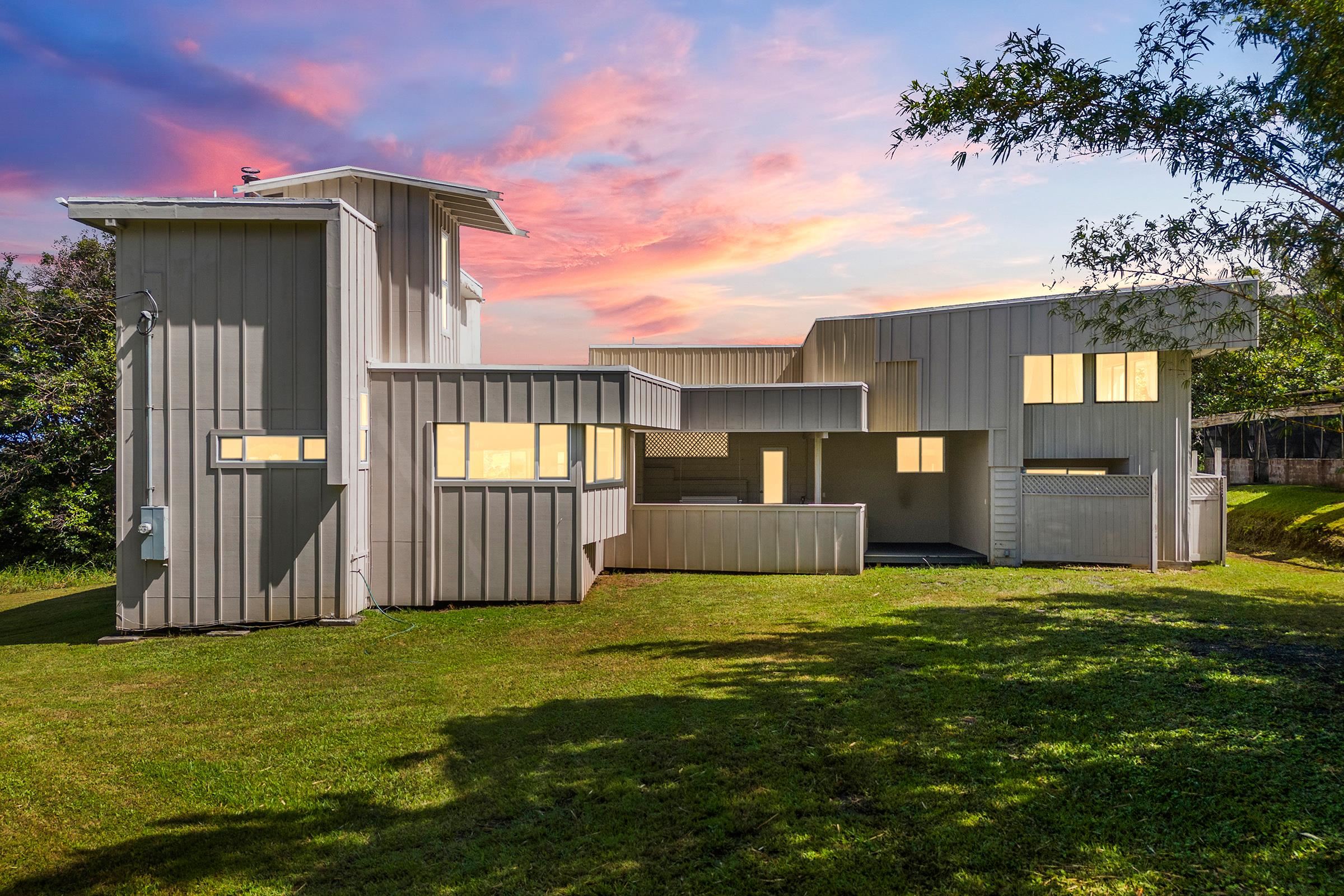 575 Awalau Road Haiku, HI 96708 - Photo 1 of 50 a front view of a house with a yard