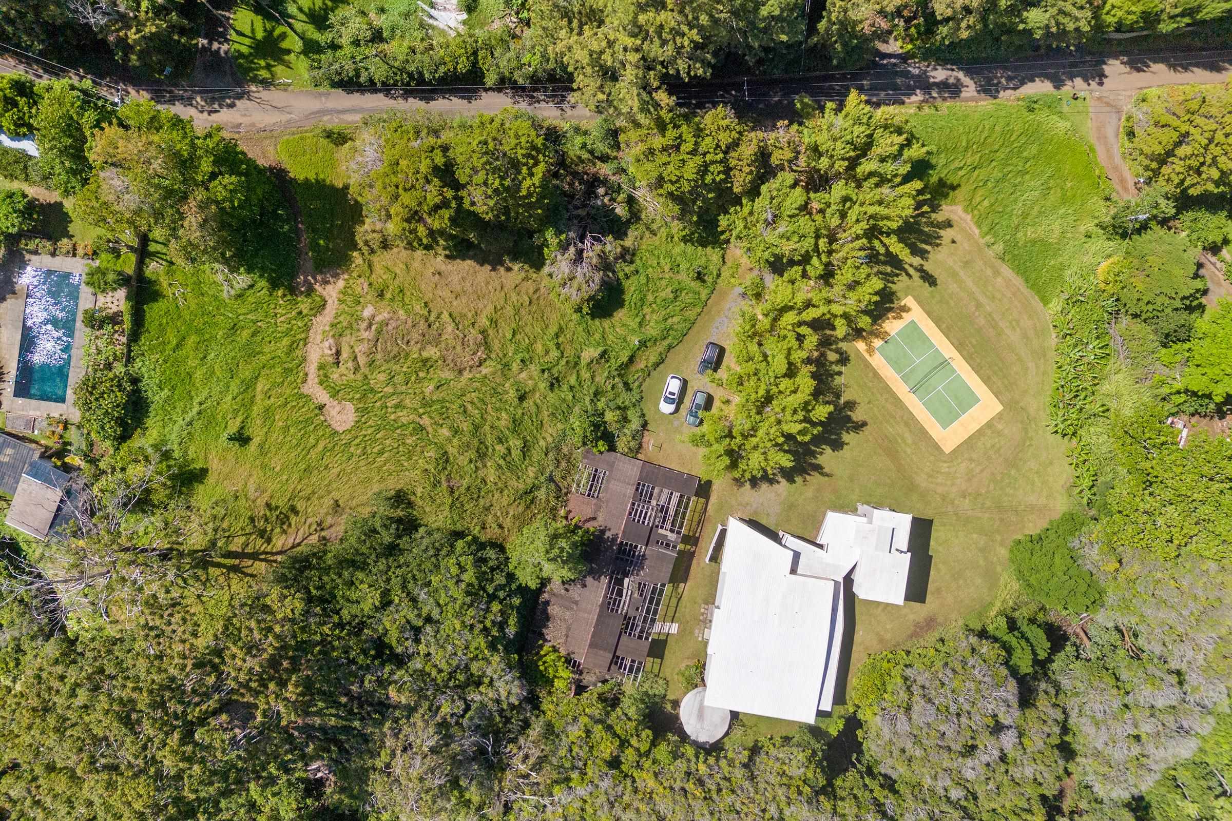 575 Awalau Road Haiku, HI 96708 - Photo 19 of 50 an aerial view of a house with a yard and lake view