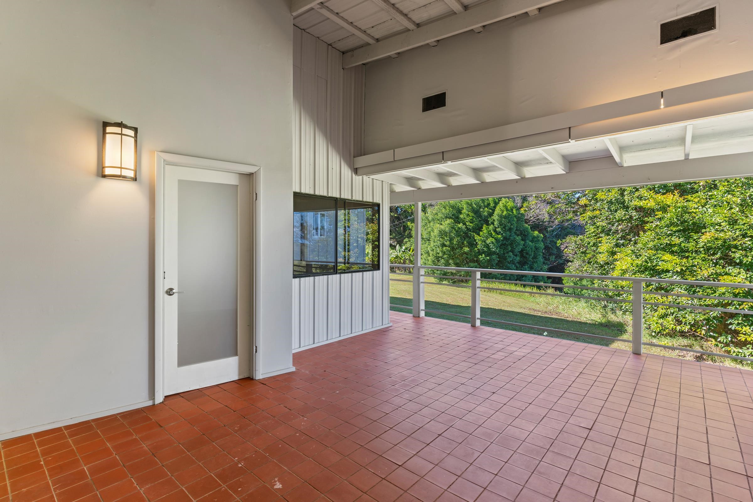 575 Awalau Road Haiku, HI 96708 - Photo 20 of 50 a view of empty room with floor to ceiling window and an outdoor view