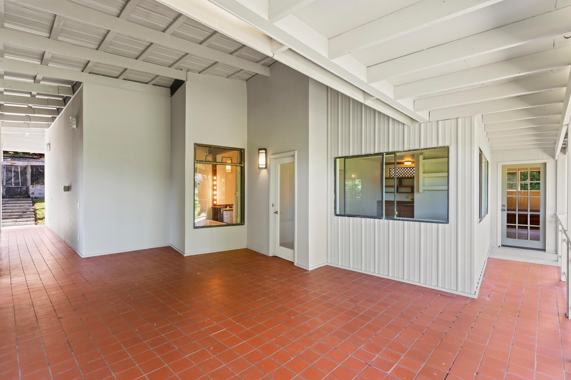 575 Awalau Road Haiku, HI 96708 - Photo 27 of 50 a view of an empty room with window and wooden floor