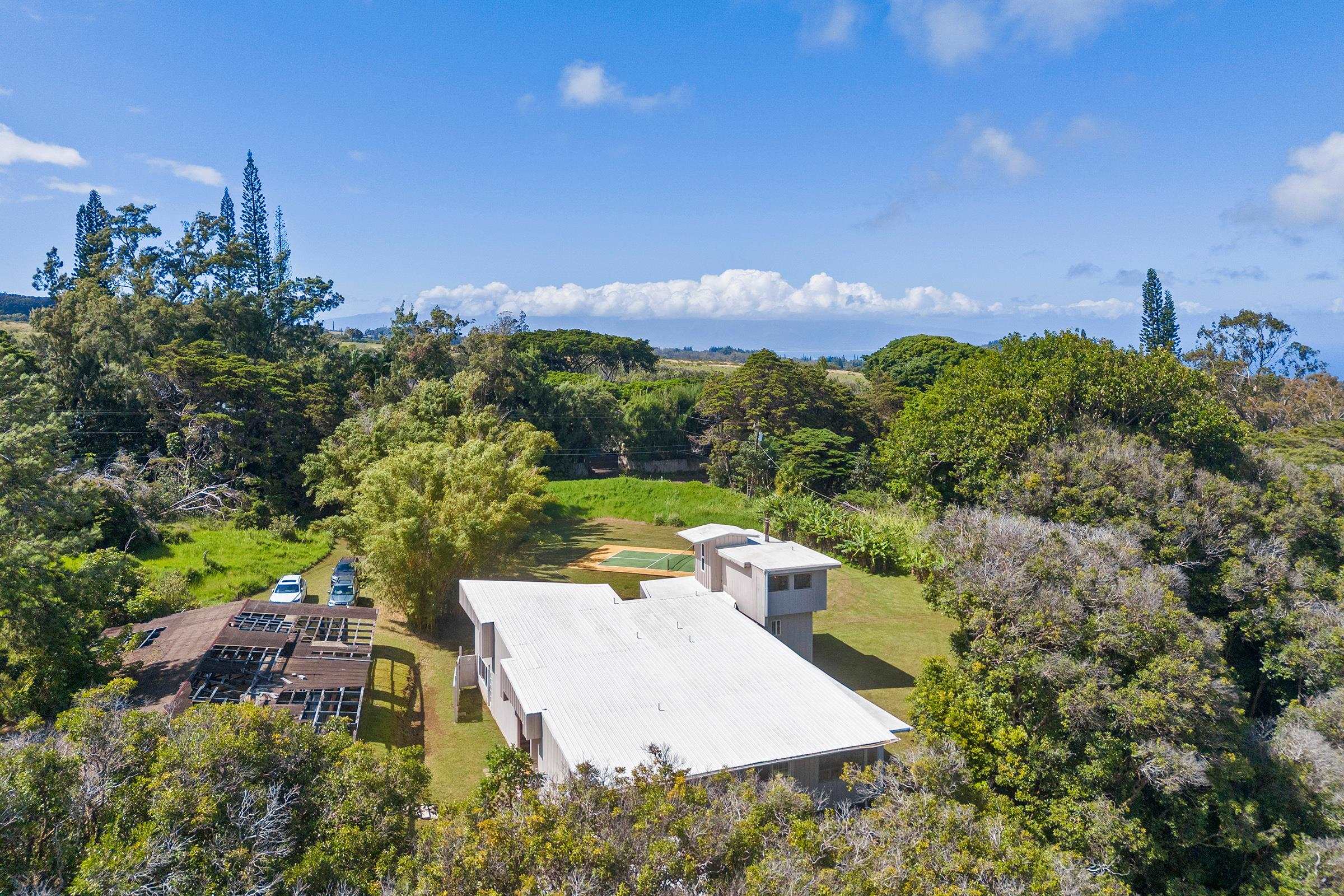 575 Awalau Road Haiku, HI 96708 - Photo 28 of 50 an aerial view of a house with a yard and lake view