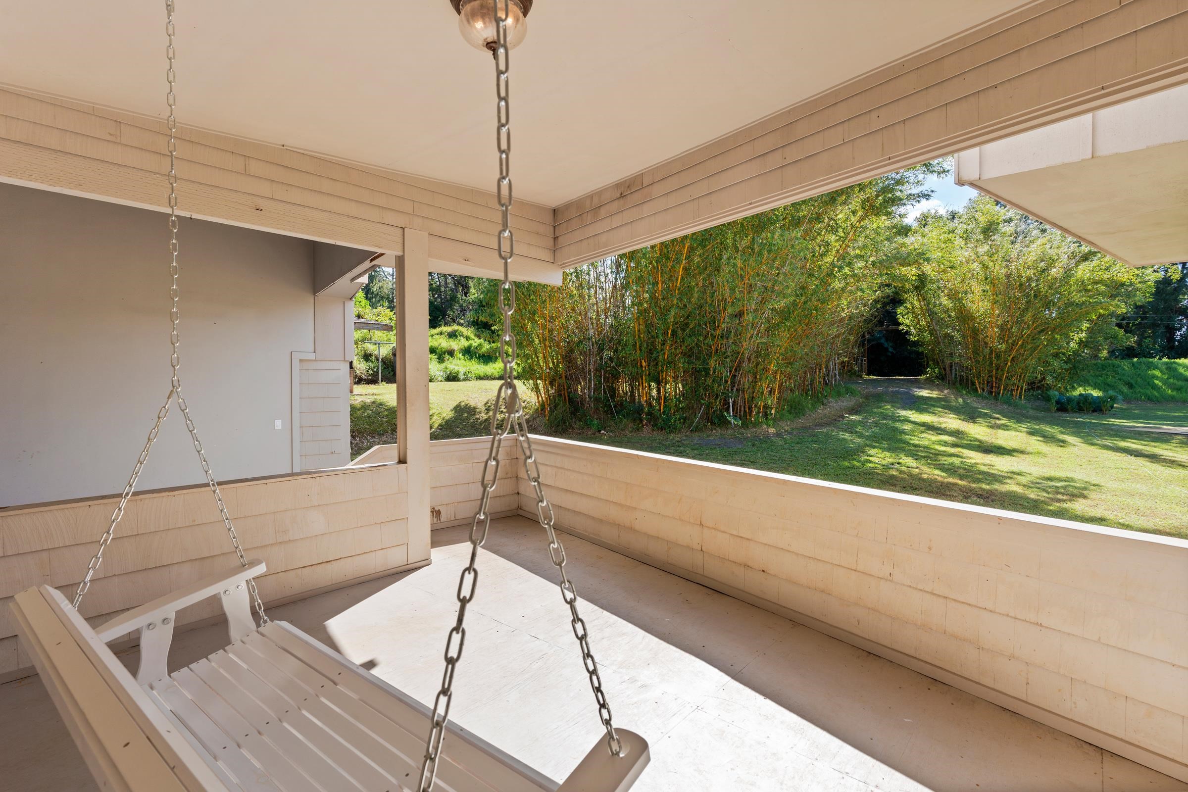 575 Awalau Road Haiku, HI 96708 - Photo 3 of 50 a bathroom with a tub and window