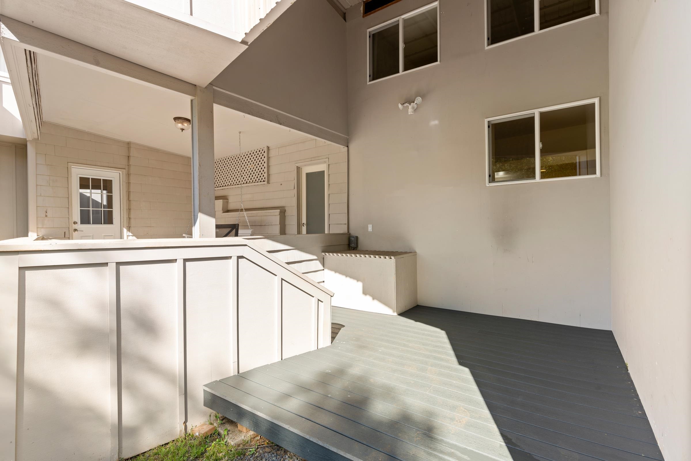 575 Awalau Road Haiku, HI 96708 - Photo 31 of 50 a kitchen with stainless steel appliances kitchen island a refrigerator sink and stove