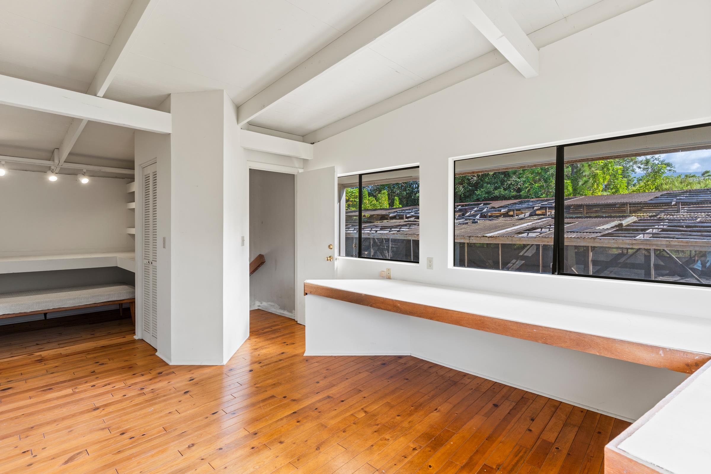 575 Awalau Road Haiku, HI 96708 - Photo 33 of 50 a view of an empty room with wooden floor and a window