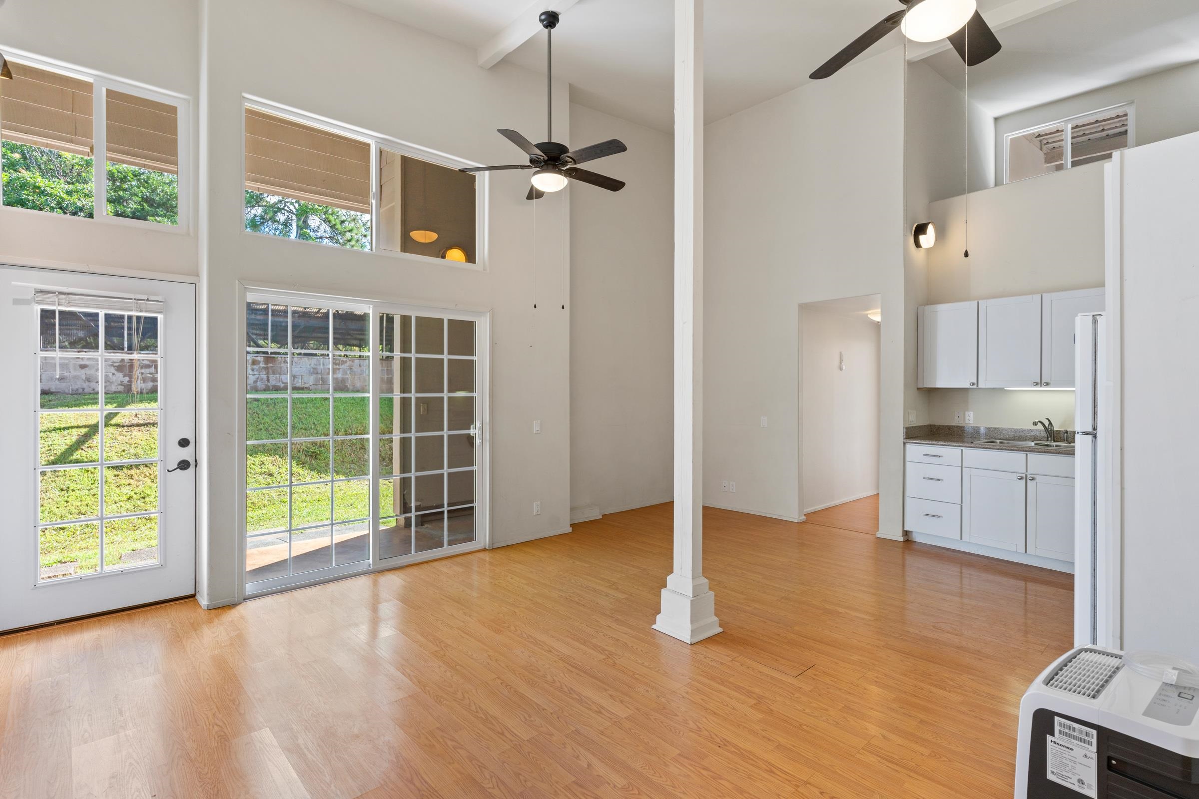 575 Awalau Road Haiku, HI 96708 - Photo 41 of 50 a view of an empty room with a window and wooden floor