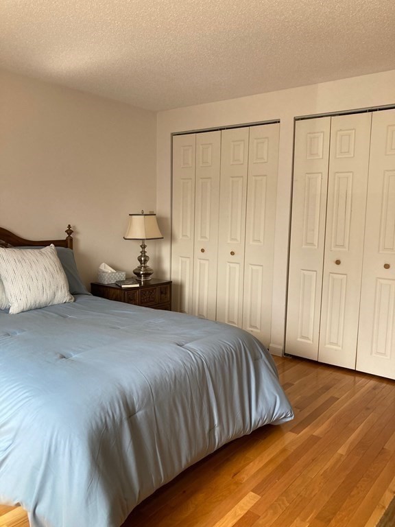 72 School Street, Unit 5 Everett, MA 02149 - Photo 11 of 21 a bedroom with a bed and a closet