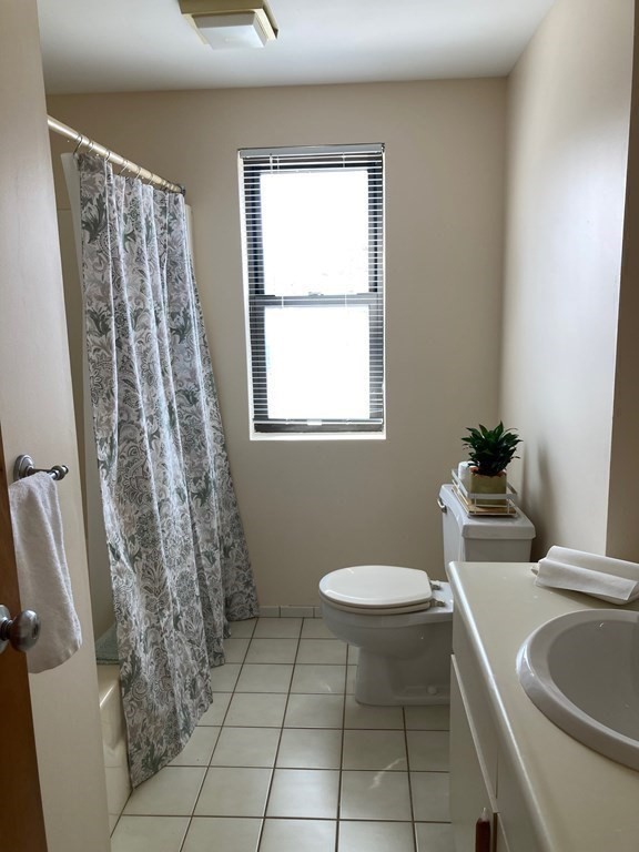 72 School Street, Unit 5 Everett, MA 02149 - Photo 15 of 21 a bathroom with a sink toilet and tub