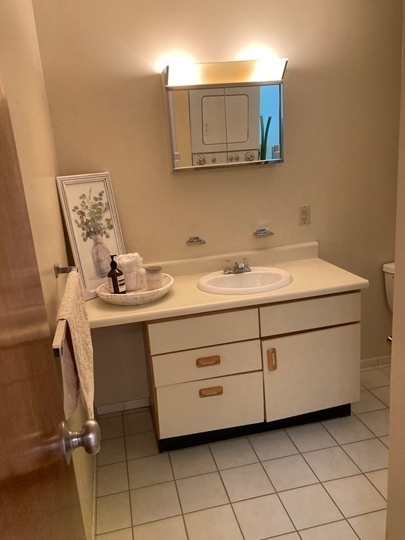 72 School Street, Unit 5 Everett, MA 02149 - Photo 19 of 21 a bathroom with a sink and a mirror