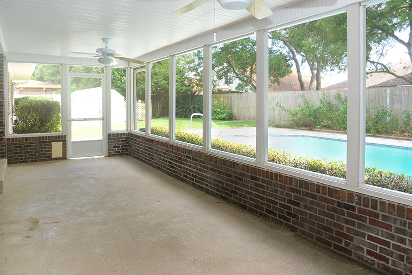 7 Elkwood Court Shalimar, FL 32579 - Photo 17 of 23 a view of a room with large windows and a table