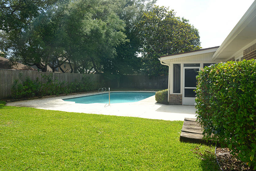 7 Elkwood Court Shalimar, FL 32579 - Photo 19 of 23 a backyard of a house with lots of green space