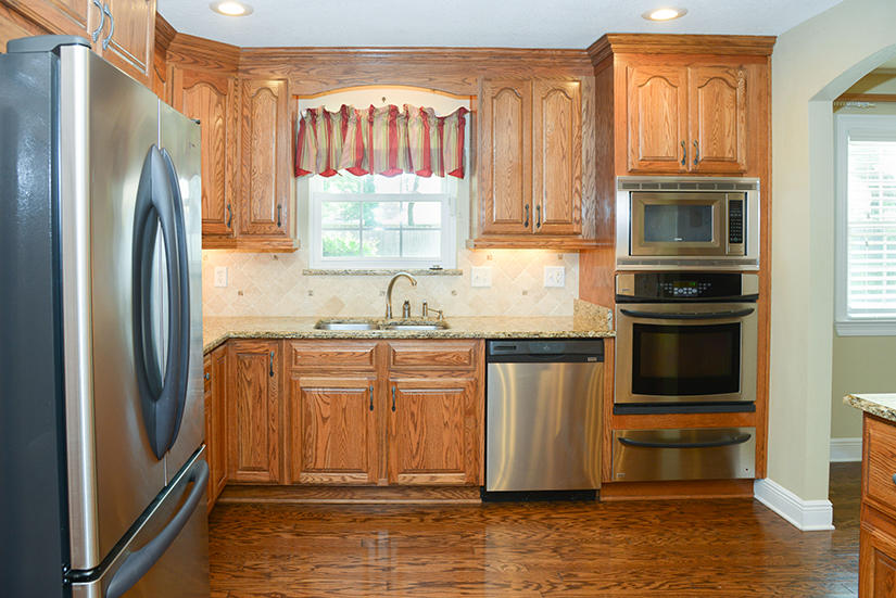 7 Elkwood Court Shalimar, FL 32579 - Photo 3 of 23 a kitchen with stainless steel appliances granite countertop a refrigerator a stove and a sink with large window