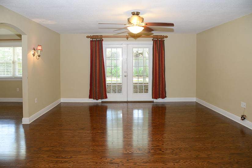 7 Elkwood Court Shalimar, FL 32579 - Photo 9 of 23 a view of an empty room with wooden floor and a window