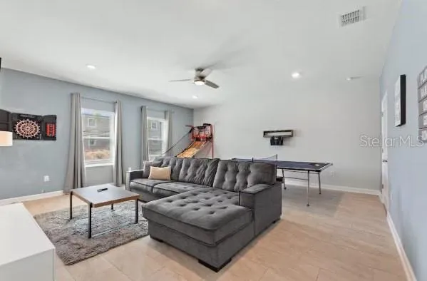 a living room with furniture and a table