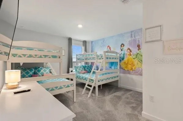 a living room with fireplace furniture and a table