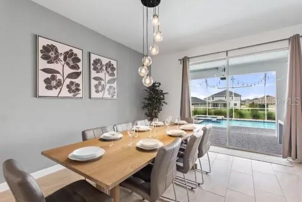 a dining room with furniture and window