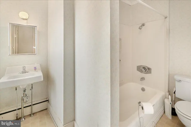 a view of a city with lush green forest