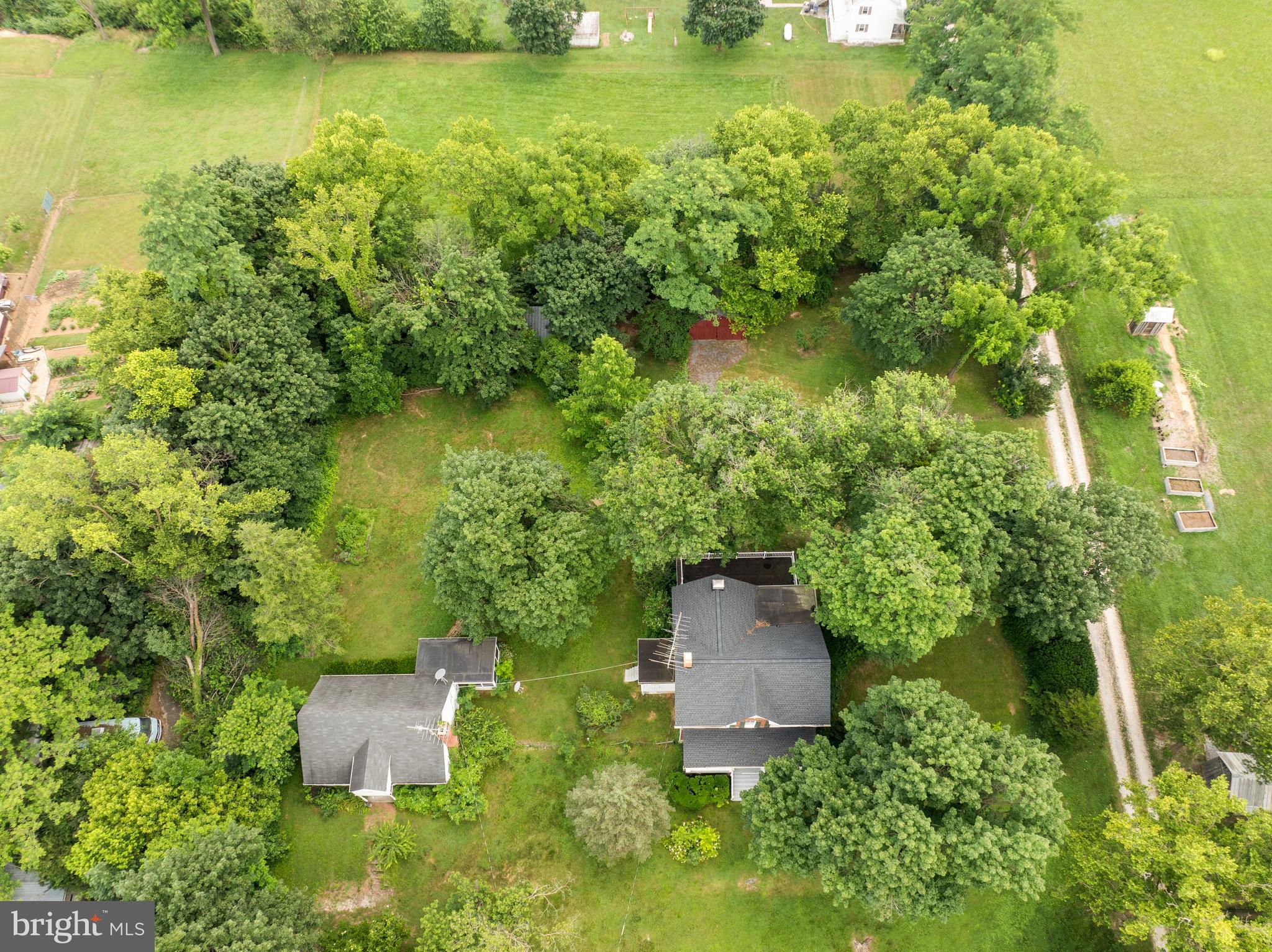 431 Mckinstrys Mill Road Union Bridge, MD 21791 - Photo 44 of 99 an aerial view of a house with a yard and lake view