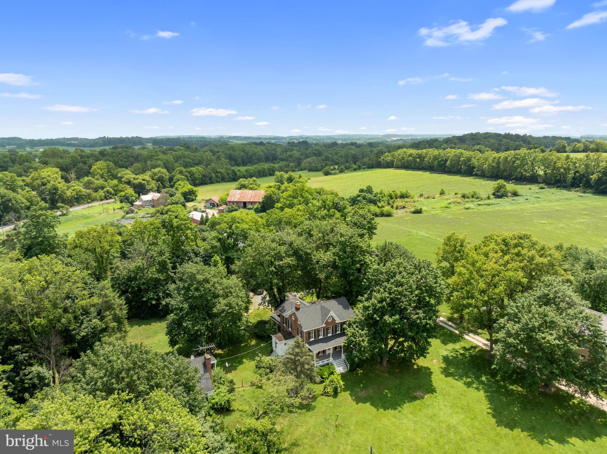 431 Mckinstrys Mill Road Union Bridge, MD 21791 - Photo 61 of 99 a view of a lake with houses in the back