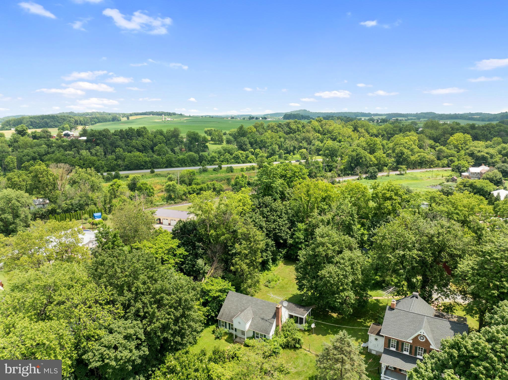 431 Mckinstrys Mill Road Union Bridge, MD 21791 - Photo 62 of 99 a view of a field of grass and trees