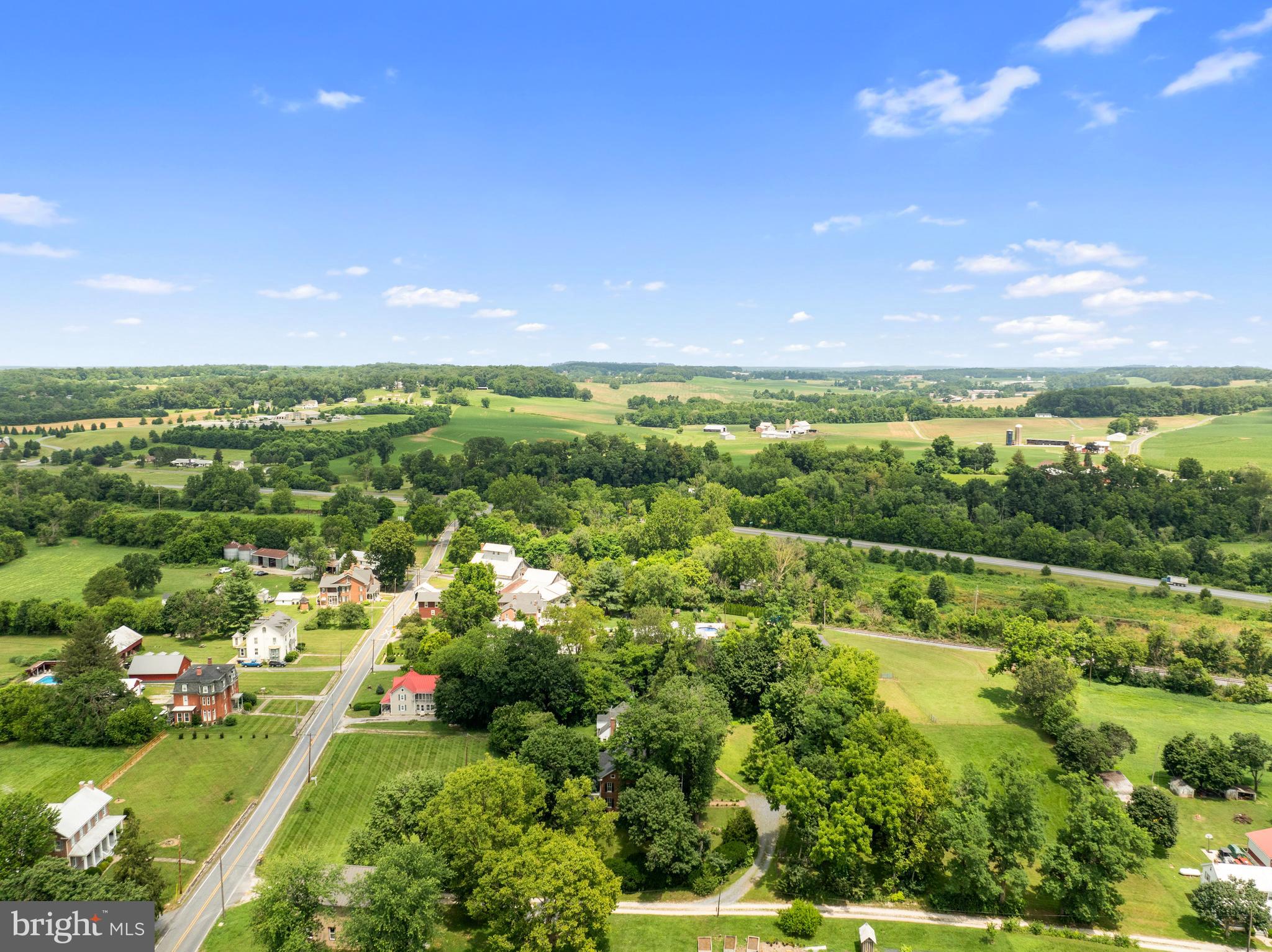 431 Mckinstrys Mill Road Union Bridge, MD 21791 - Photo 71 of 99 a view of a city with lush green forest