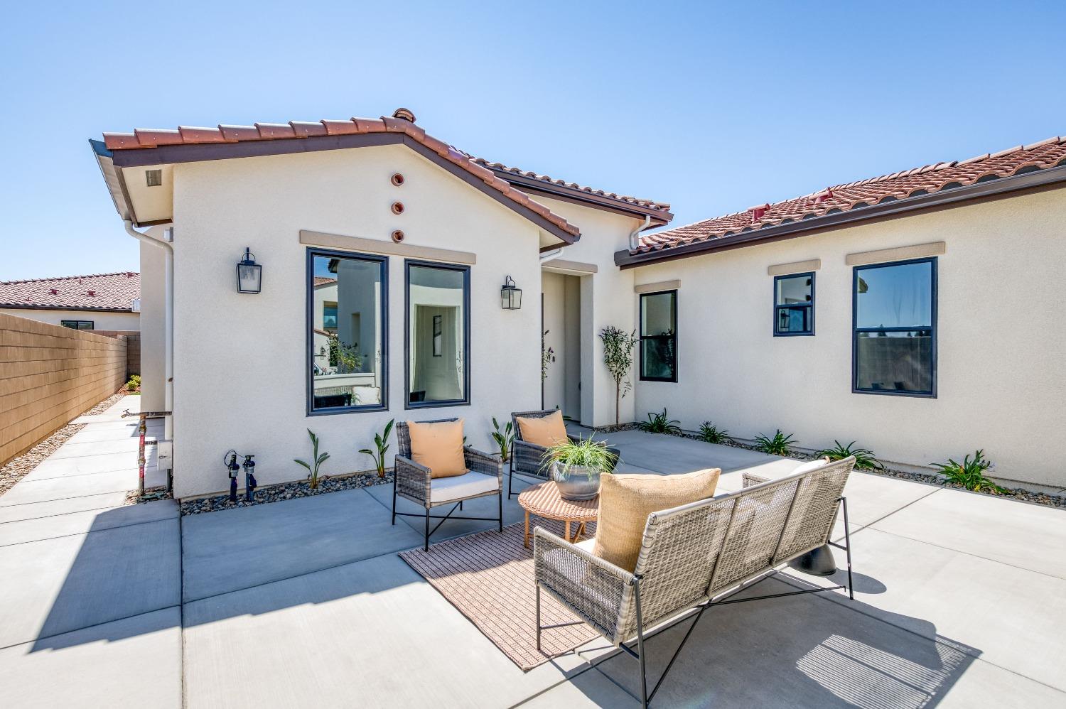 a outdoor space with patio the couches and a potted plant on a table