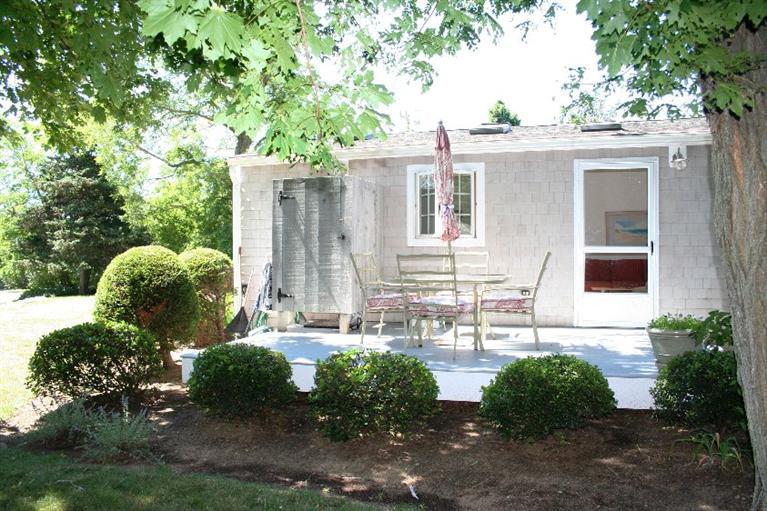 26 Locust Road, Unit 26 Eastham, MA 02642 - Photo 3 of 16 front view of house with a yard