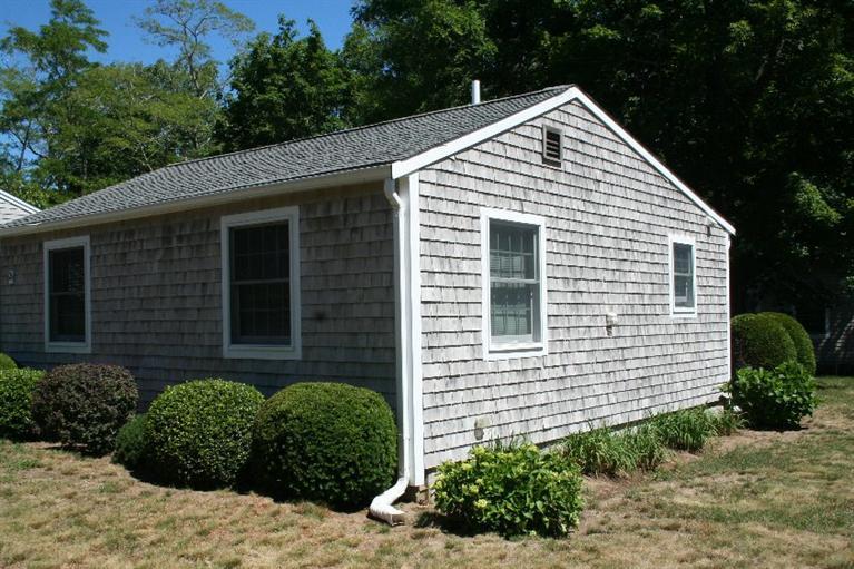 26 Locust Road, Unit 26 Eastham, MA 02642 - Photo 4 of 16 a view of a house with a yard