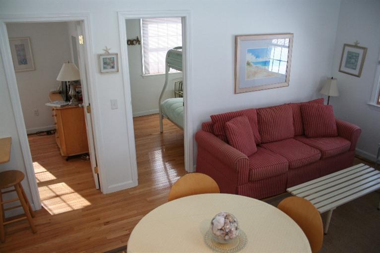 26 Locust Road, Unit 26 Eastham, MA 02642 - Photo 8 of 16 a living room with furniture and wooden floor