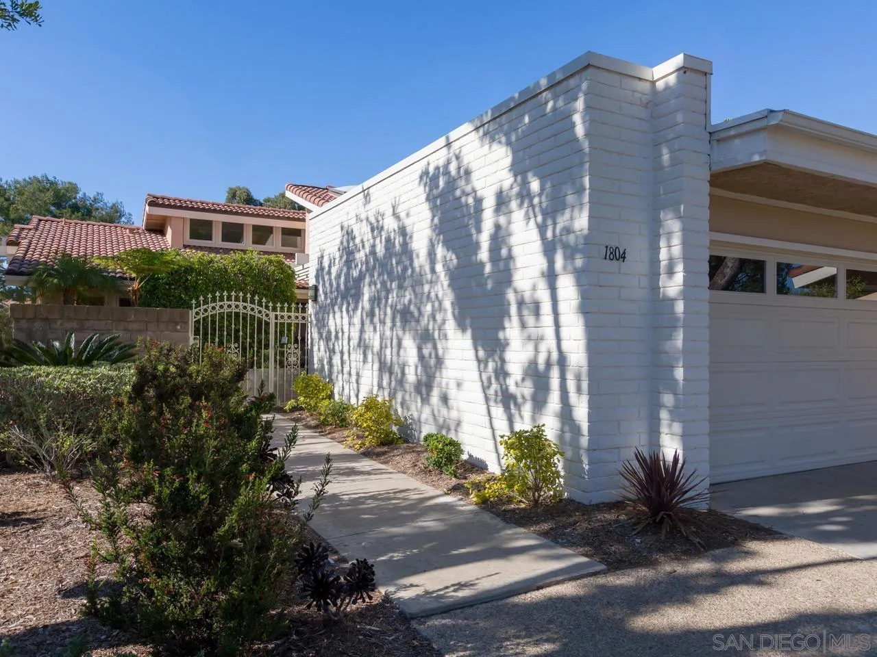 1804 Caminito Ascua La Jolla, CA 92037 - Photo 13 of 20 a front view of a house with a yard