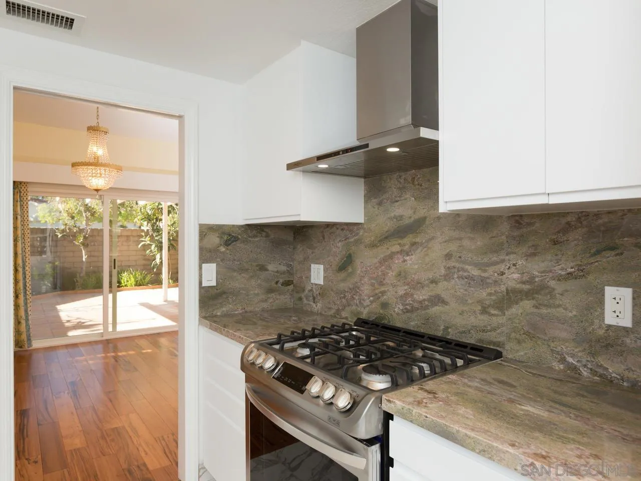 1804 Caminito Ascua La Jolla, CA 92037 - Photo 14 of 20 a stove top oven sitting inside of a kitchen