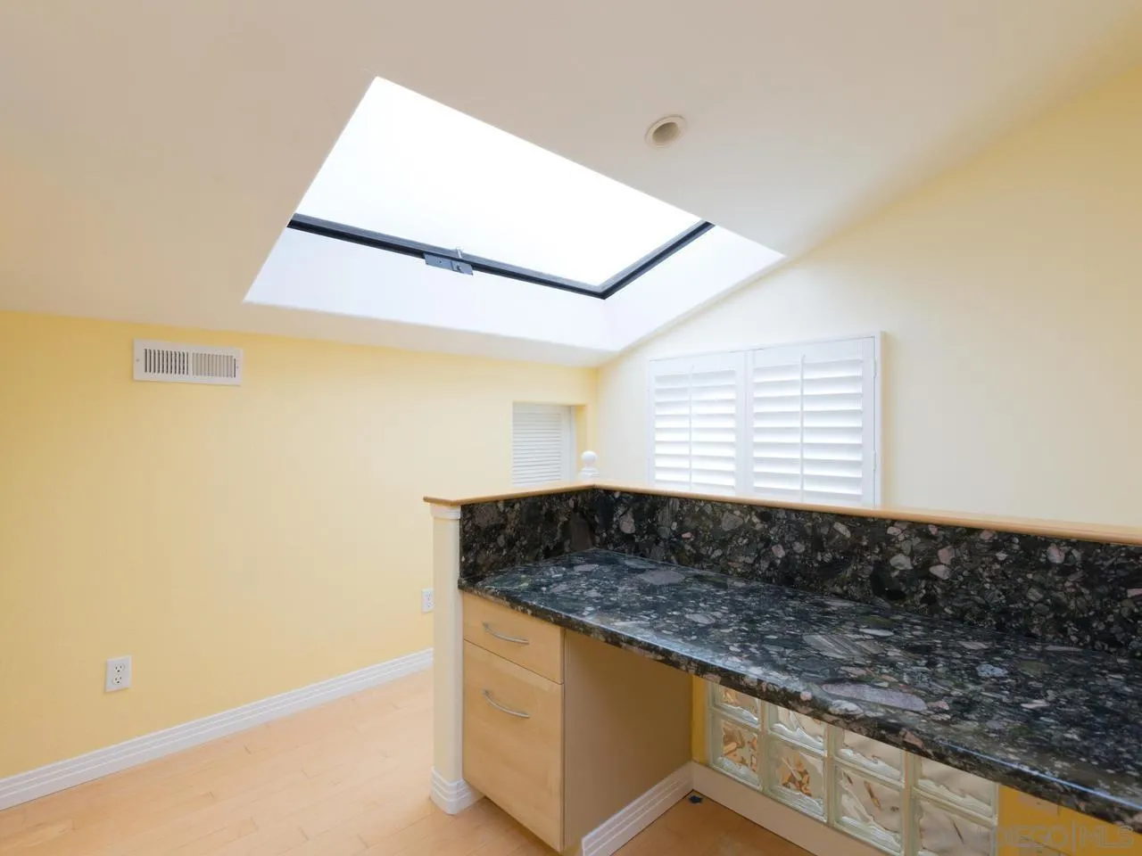 1804 Caminito Ascua La Jolla, CA 92037 - Photo 17 of 20 a kitchen with granite countertop white cabinets and window