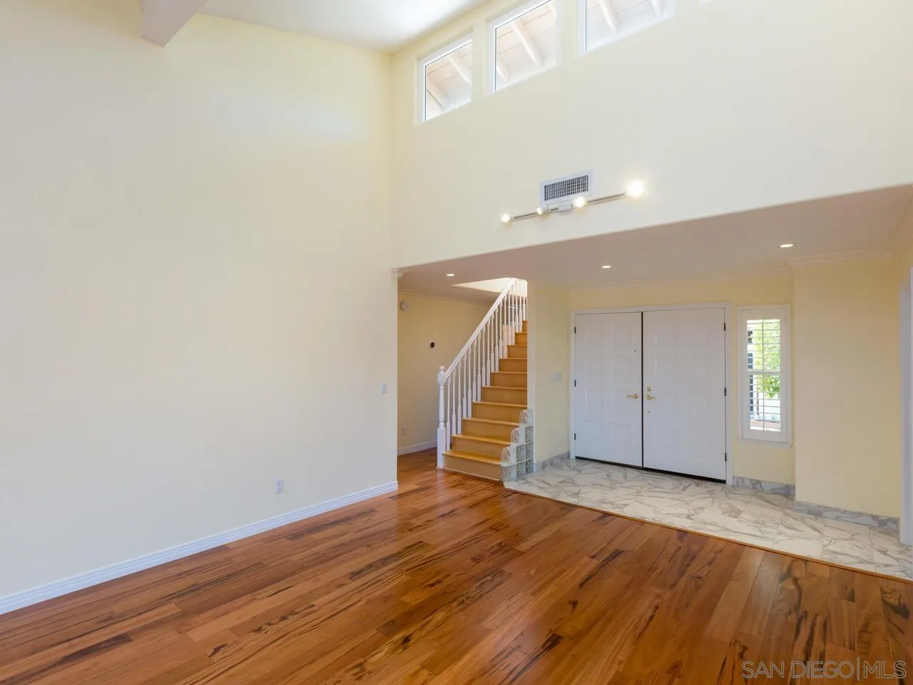 1804 Caminito Ascua La Jolla, CA 92037 - Photo 19 of 20 a view of an empty room with wooden floor