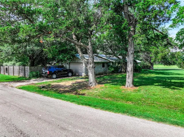 a aerial view of a house with a big yard