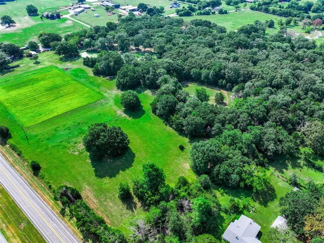 a view of a garden with a building