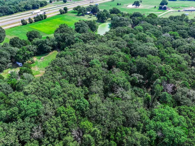 a backyard of a house with a yard and outdoor seating